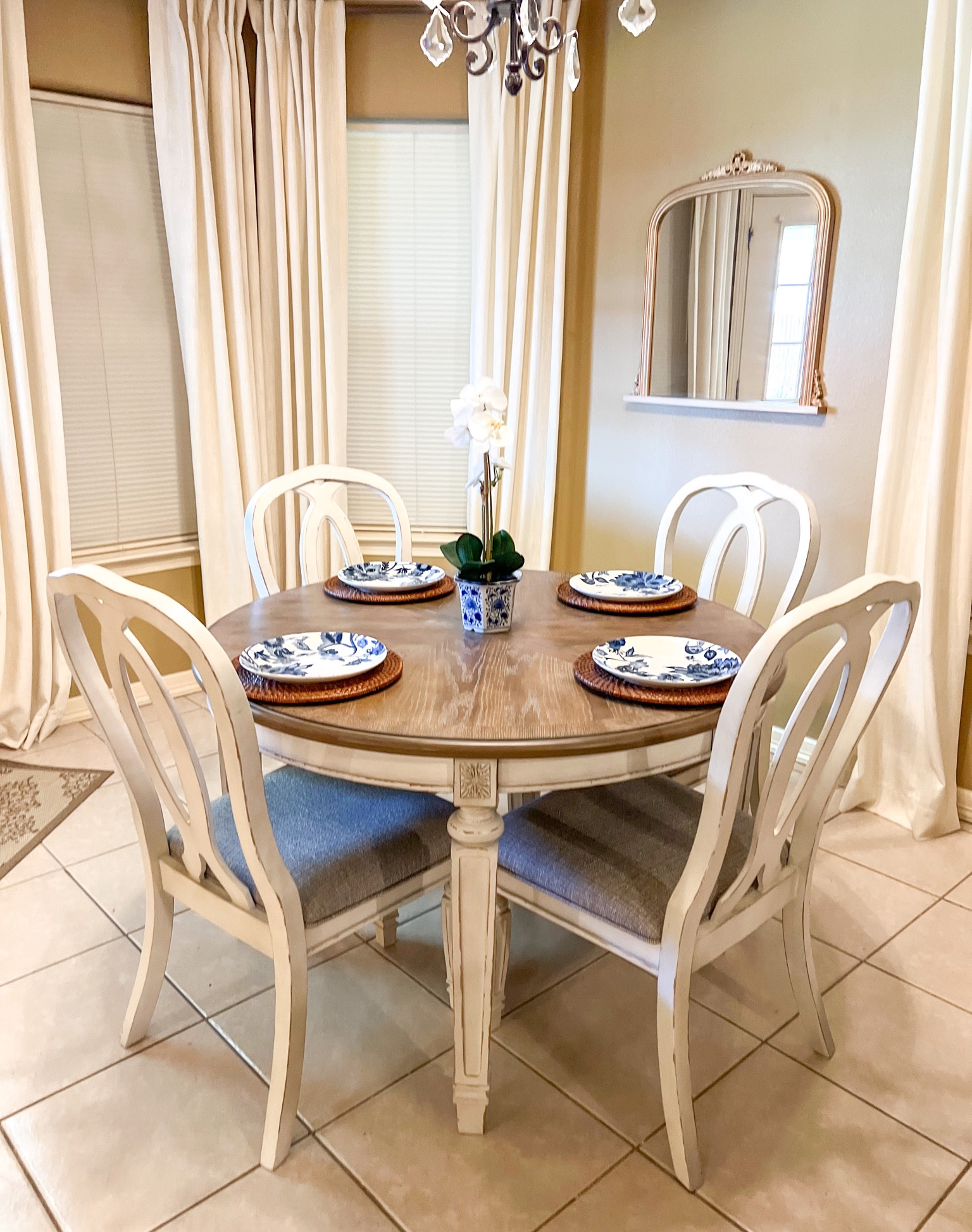 Round dining table
Chairs
White
Two tone table
French Country 
Ashley furniture 
Ivory linen curtains 


#LTKstyletip #LTKhome #LTKSeasonal