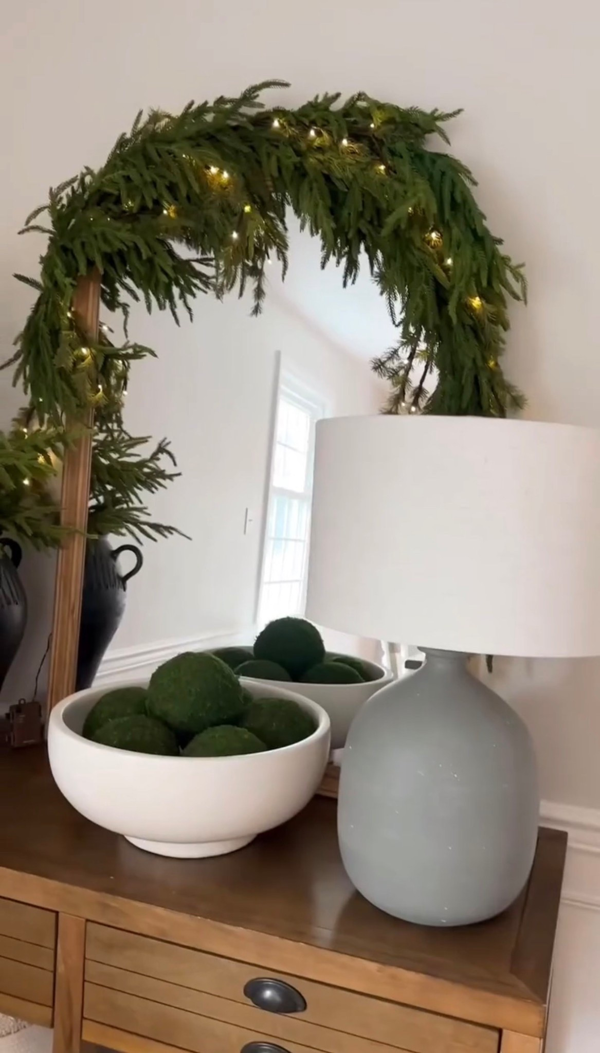 Easy garland idea for a large mirror or piece of art! I love the twinkling lights!

#LTKHoliday #LTKFindsUnder100 #LTKSeasonal