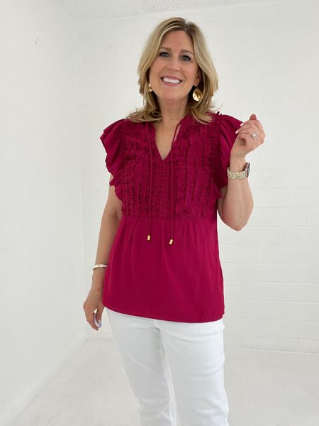 Victoria ruffle tunic top.  
Made from sleek satin with romantic ruffles, this short-sleeve tunic creates a wonderfully flattering silhouette thanks to its waist-cinching seam. Drawstring details add a touch of movement at the split neckline. Pair with slim-fitting pants and sparkling sandals for an elegant evening out ensemble.

Generous sizing.  Color Sangria
Currently on sale!

#LTKsalealert #LTKstyletip #LTKfindsunder100