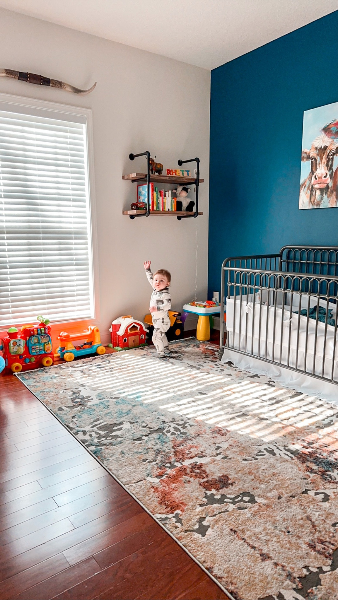 Love this industrial shelf in Rhett’s room so much! 
Western decor western nursery western toddler room cow canvas picture crib metal crib farmhouse nursery farmhouse rug western rug 

#LTKbaby #LTKhome #LTKfamily