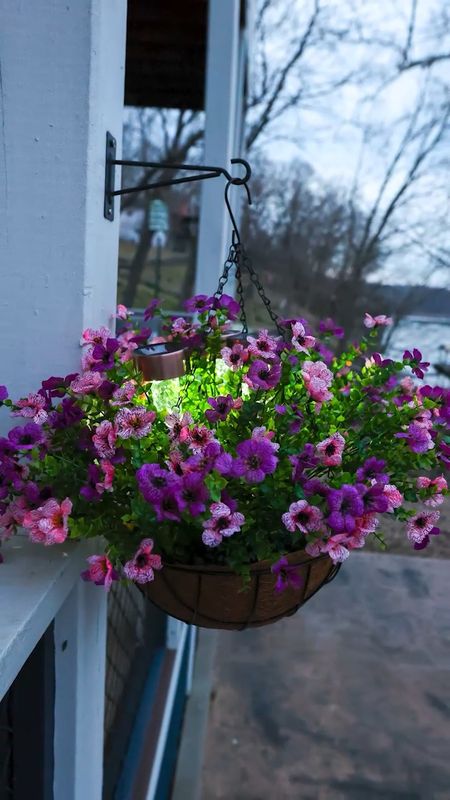 Hanging basket solar hack! 🌸☀️ 
When I found this faux hanging basket on Amazon I knew I had to share it! 🤩 This would be perfect to hang now while we still get cold weather at night or in really hot climates where it’s difficult to keep things growing! I added some extra flair by adding 3 solar lights ✨ from Dollar Tree! 🌳

#LTKhome #LTKVideo #LTKSeasonal