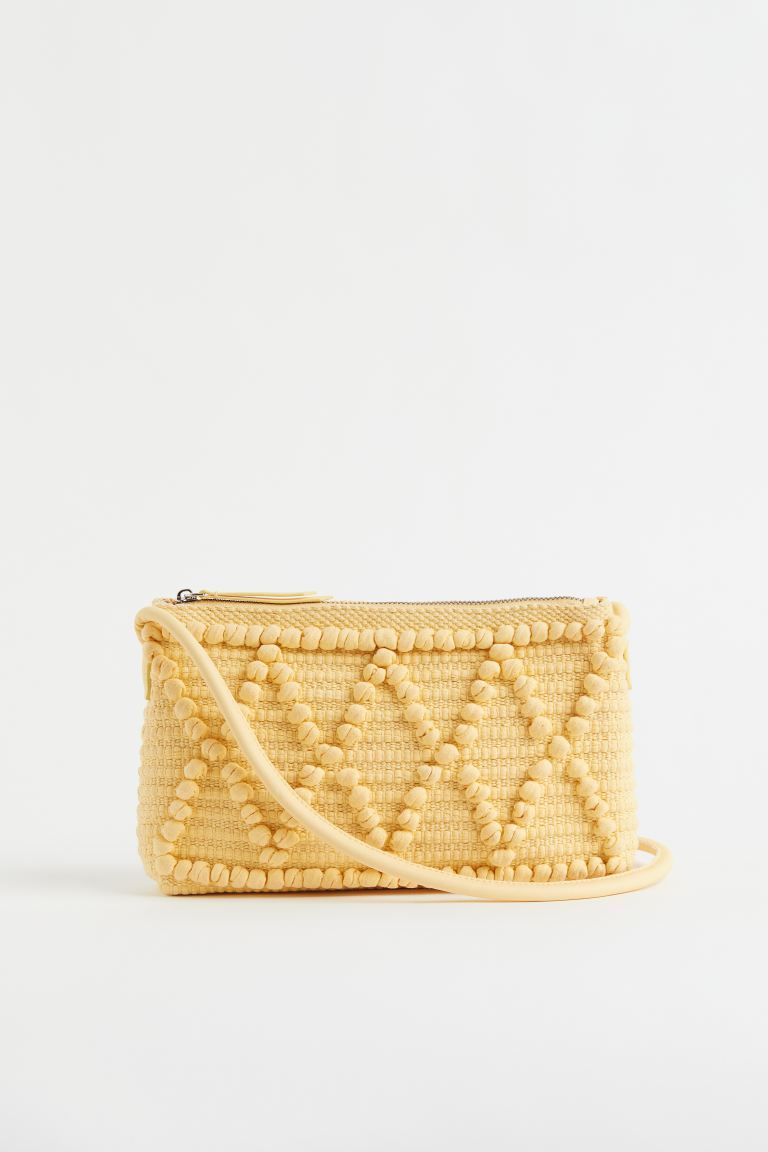 Small shoulder bag in textured, woven cotton fabric. Narrow shoulder strap in faux leather, zippe... | H&M (US + CA)