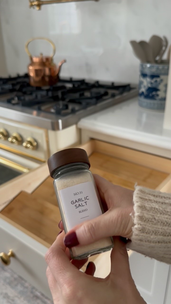 Tiny kitchen upgrade that makes such a difference. I swapped my spice jar lids for these walnut ones and love the little bit of warmth they bring to the drawer two years later! 🤎

Necessary? Debatable. Do I smile every time I open the drawer? Yes.

Comment SHOP and I’ll send you everything you see here + all of my kitchen details!

#classichomedecor #cottagekitchen #kitchenorganizer #spicedrawer #spicejars