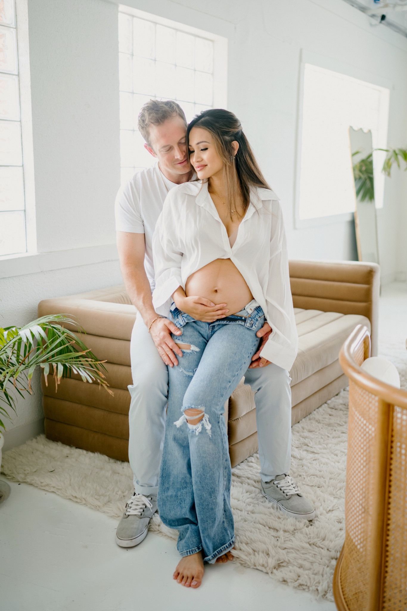 Maternity photos, white button down, flare jeans 

#LTKbaby #LTKfamily #LTKbump