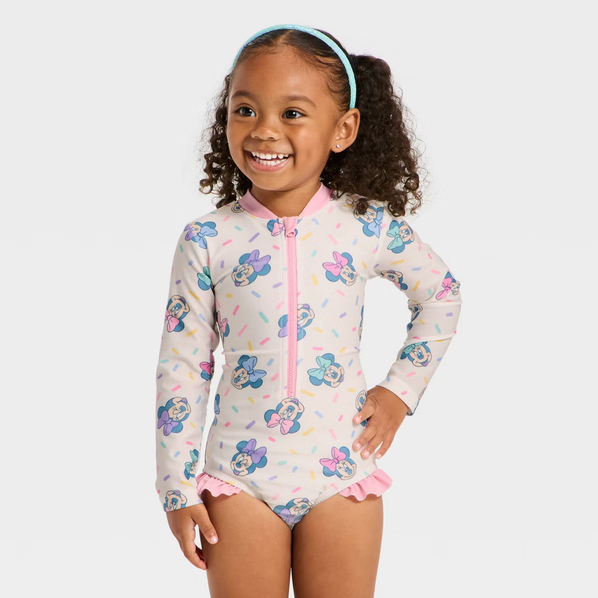 Toddler Girls' Disney Long Sleeve Minnie Mouse Sprinkle Printed One Piece Rash Guard - White | Target