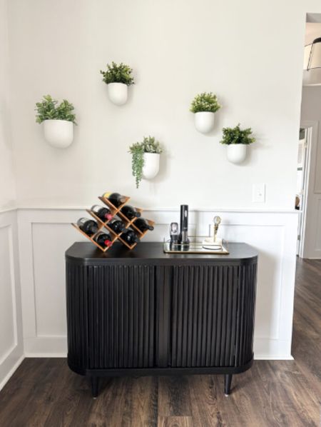 I had a storage cabinet to repurpose and an empty wall in our dining room, so I created a little wine bar. (My cabinet is unable to be linked - Hensley cabinet from World Market, but similar are below)

#LTKhome