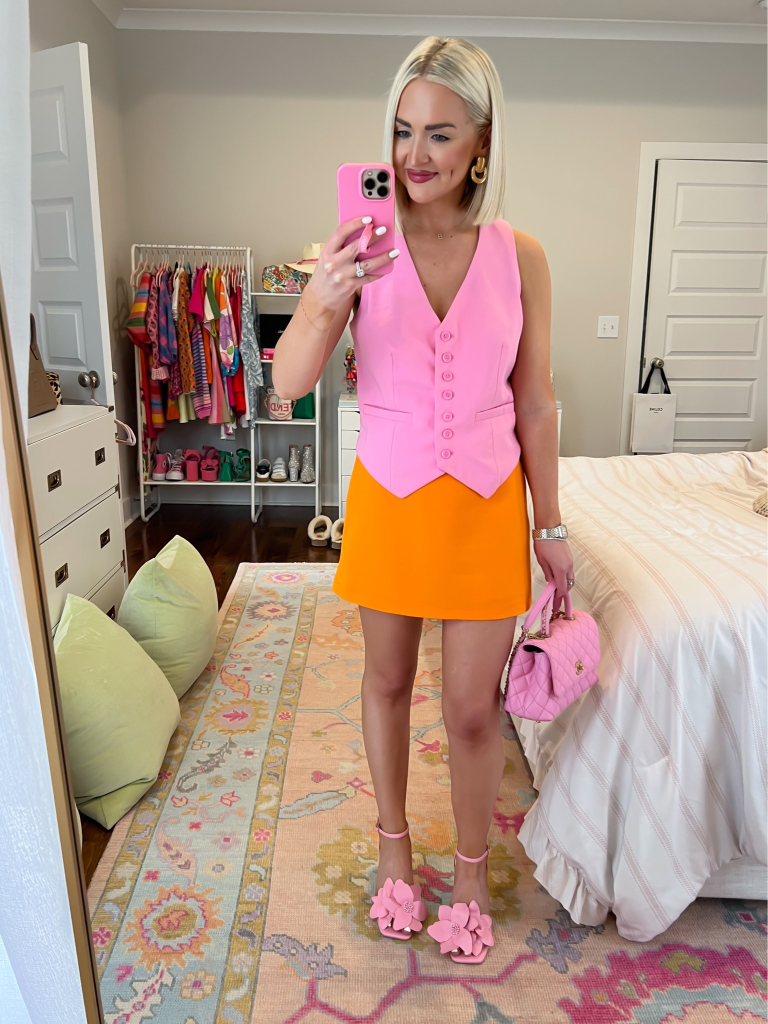 Pink vest (XS) / orange skirt (XS) / pink and orange outfit 

#LTKStyleTip