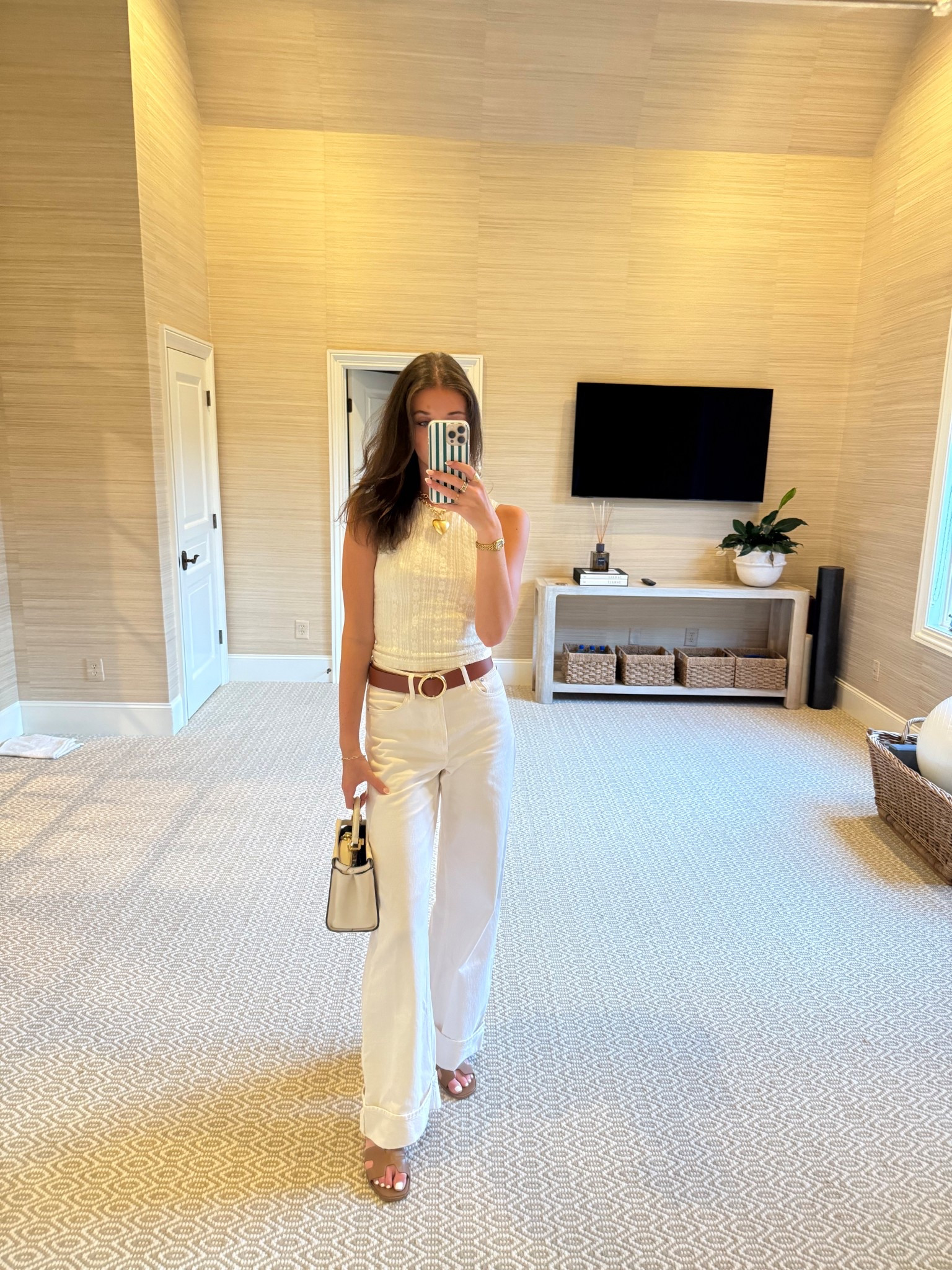 White princess polly patterned tank. Tan and gold circle belt. White boot cut jeans. Tan steve madden sandals. Gold roxanne assolin gold necklace. Heart necklace. Steve madden tan shoes. Travel outfit. Vacation outfit. Work outfit. Dinner outfit. Monochrome outfitt

#LTKStyleTip #LTKTravel #LTKWorkwear