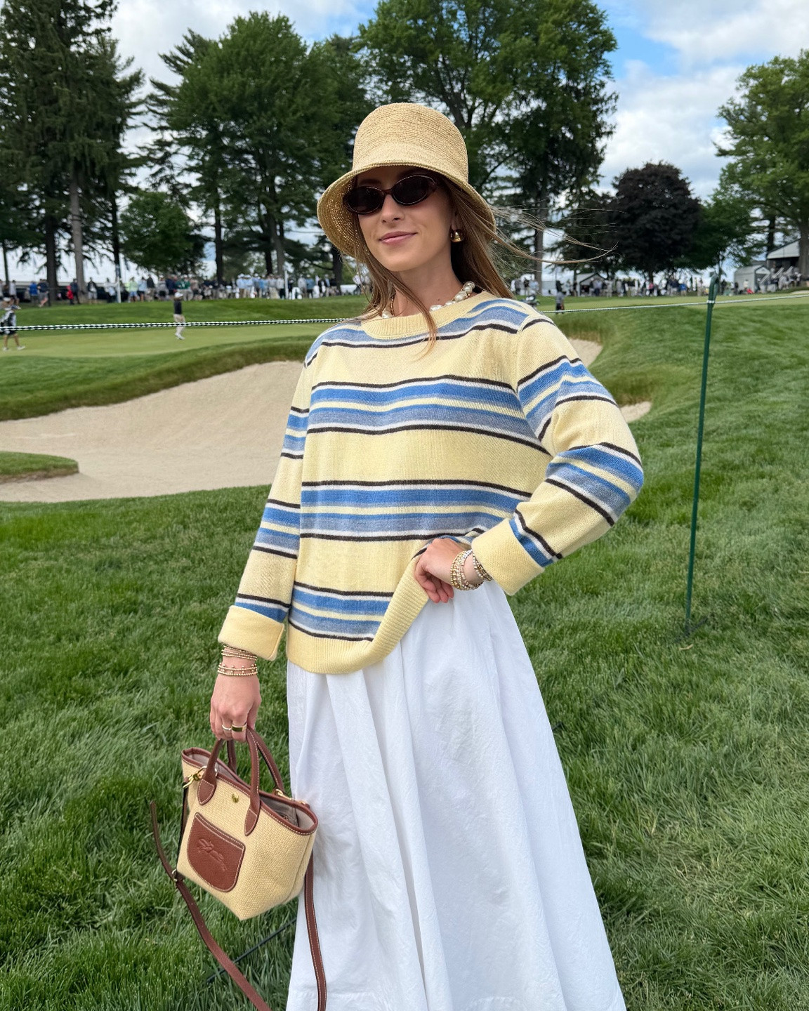 5/14/26 PGA Championship Spectator Outfit

What I wore for a day at the PGA Championship 🤍 my Aritzia white dress layered with a striped Reformation sweater, plus a bucket hat, Longchamp bag, and easy sneakers for walking around all day. Comfortable but still put together—everything is linked here ✨

#LTKootd #LTKSeasonal