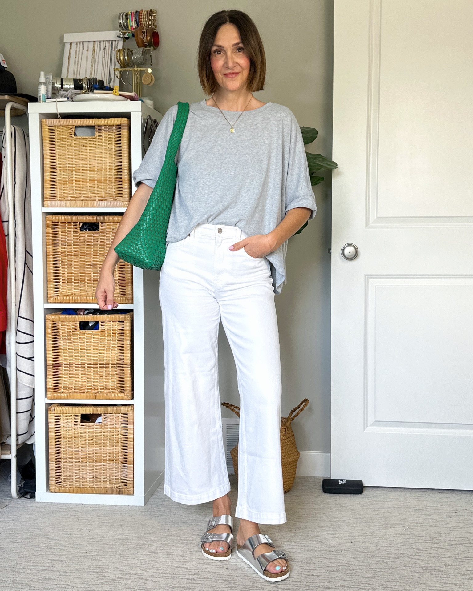 Casual spring outfit with a pop of color! I have this bag in beige and red and wear them all the time, it’s such a good basic bag and comes in tons of fun colors.
Wearing my usual size S in the drapy tee and sized down one to 26 in the jeans (I had my usual 27 but they stretched out with wash and wear).
Silver Birkenstocks fit tts and are so comfortable. I also linked a similar less expensive pair from Amazon, they come in silver but don’t look as shiny as mine.


#LTKFindsUnder50 #LTKItBag #LTKShoeCrush