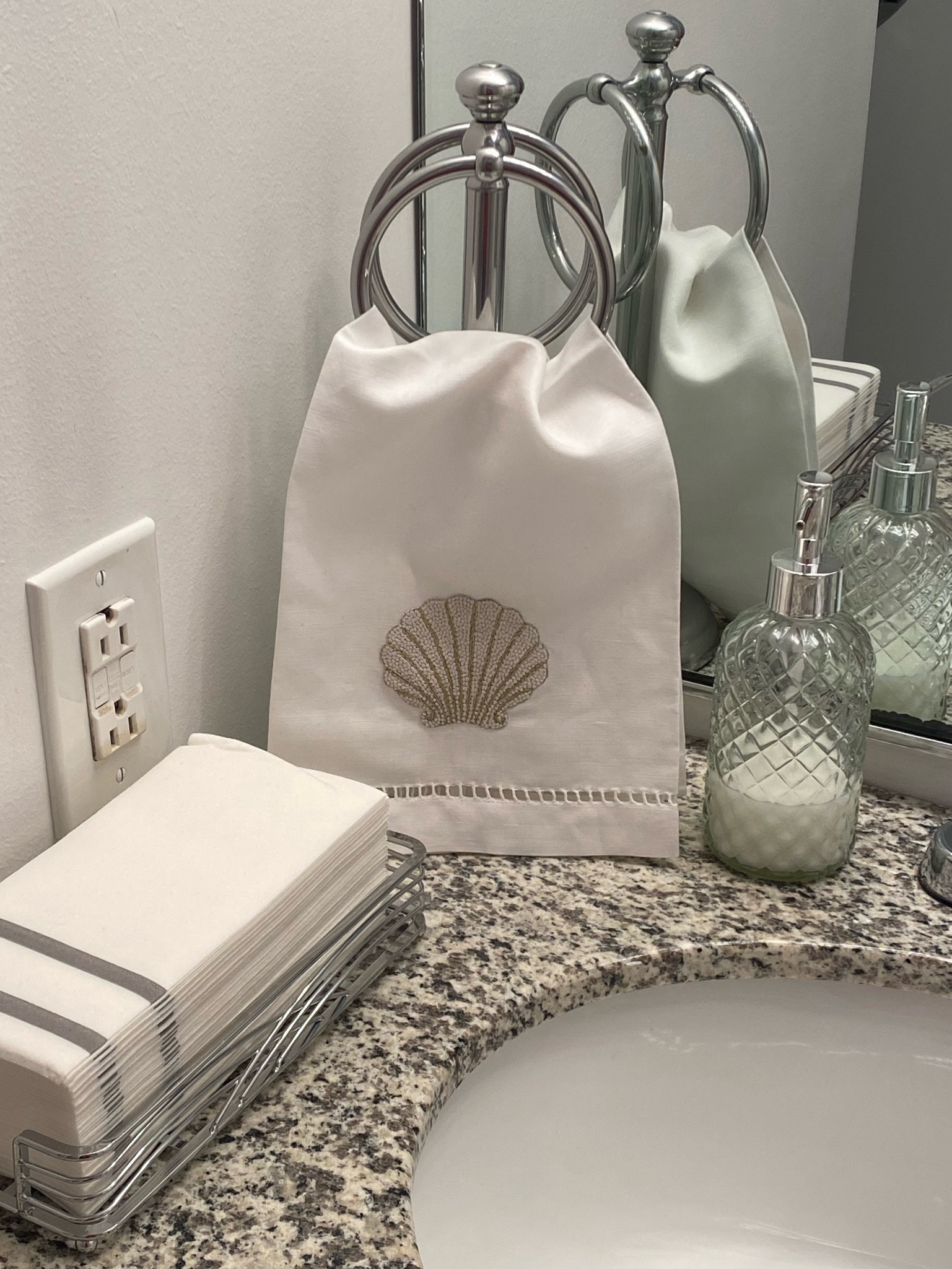 When I moved in, I found a shell on my deck. I believe in signs and fate. Trying to work shells into my space where I can in a minimal way. 
Towel ring, napkin holder are from Amazon! Search “chrome double towel ring” and “chrome napkin holder for bathroom.” Soap dispenser is part of a set from Amazon, too. 

#LTKhome