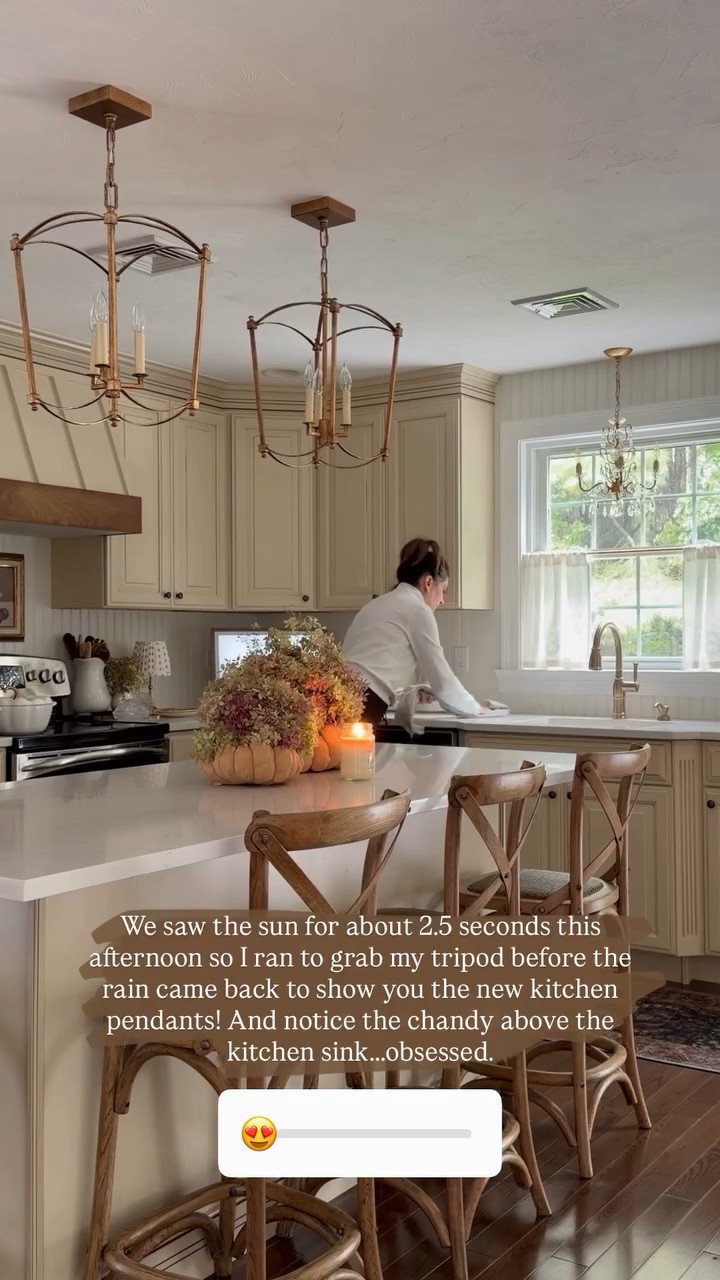 We saw the sun for about 2.5 seconds this afternoon so I ran to grab my tripod before the rain came back to show you the new kitchen pendants! And notice the chandy above the kitchen sink…..obsessed.