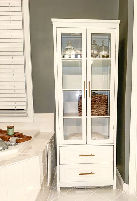 Affordable Bathroom Cabinet from Walmart. Several shelves for the perfect amount of storage. Two drawers perfect for toilet paper and extra towels. White with gold handles. #walmart #walmarthome #sale #homedecor #bathroom #cabinet 

#LTKhome #LTKsalealert