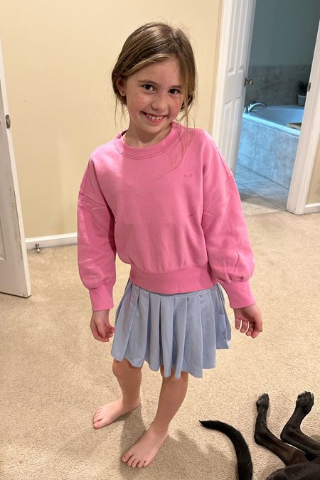 Built in shorts, skirt runs a little big. She already asked for the skirt in another color 