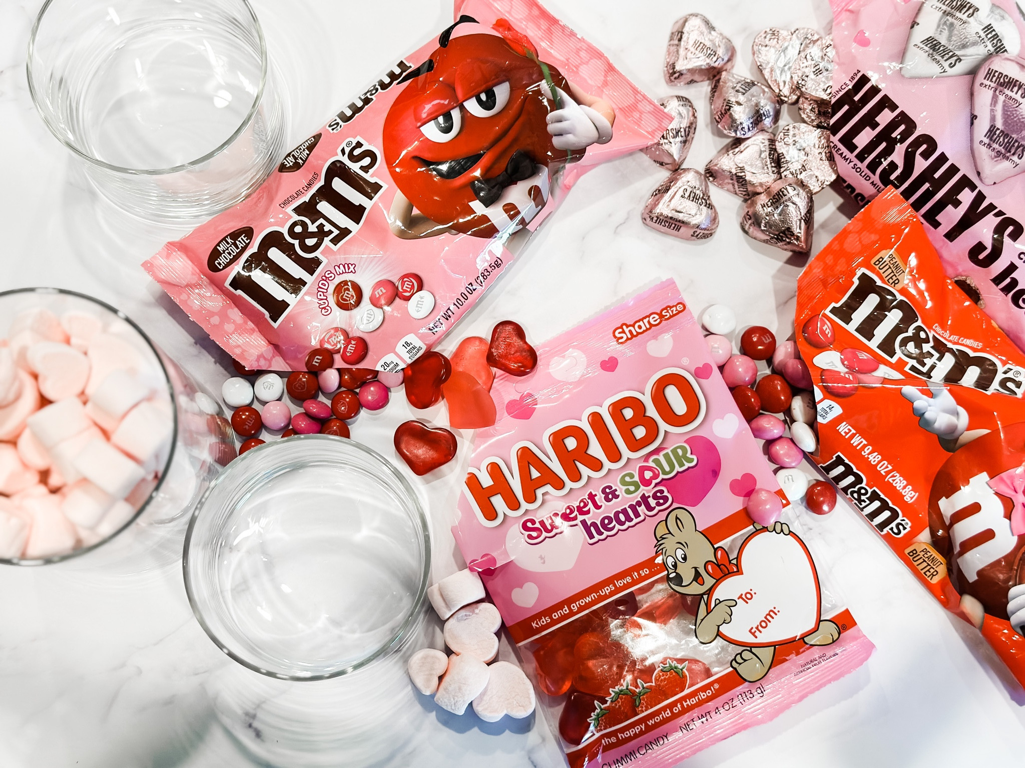 Who is ready for the season of love?
I am working on prepping the #valentines themed #candybar  and so excited with the selection of candies this year! Loving these @mmschocolate @haribousa gummies and @hersheys chocolates! PS Grab the strawberry heart marshmallows! ♥️ You’re  welcome. 

#LTKfamily #LTKSeasonal #LTKhome