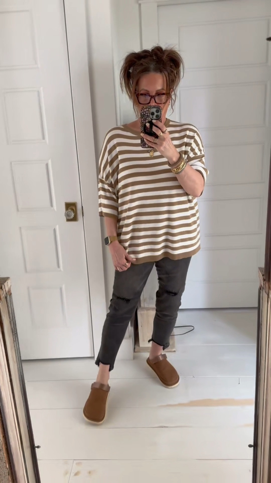 My outfit of the day includes a soft lip look, space buns, a black denim, strappy clogs, and a cozy oversized striped top. I feel like this is a great upbeat look for Spring. 

#LTKWatchNow #LTKMidsize #LTKStyleTip