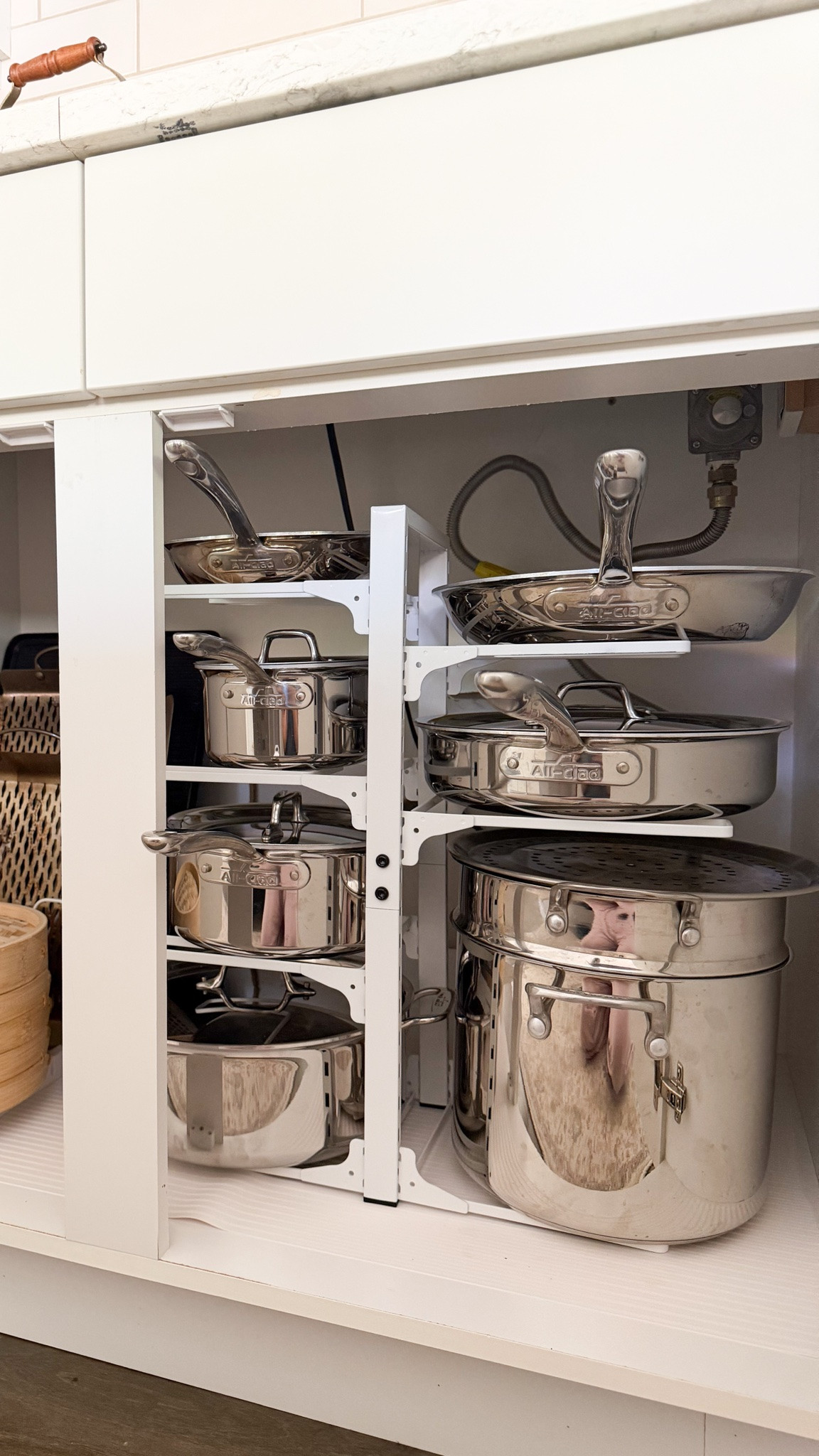 COOKWARE + ORGANIZER!
So happy I switched to stainless steel pots and pans!

Pots and pans organization under stove! 

Pots and pans organizer, stainless steel cookware set, shelf rack, bamboo steamer basket

#LTKsummer #LTKhome