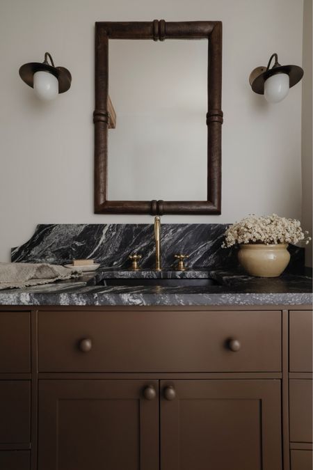 Primary bathroom // brown vanity // unlacquered brass faucet // rustic wood mirror // antique brass sconces

#LTKhome