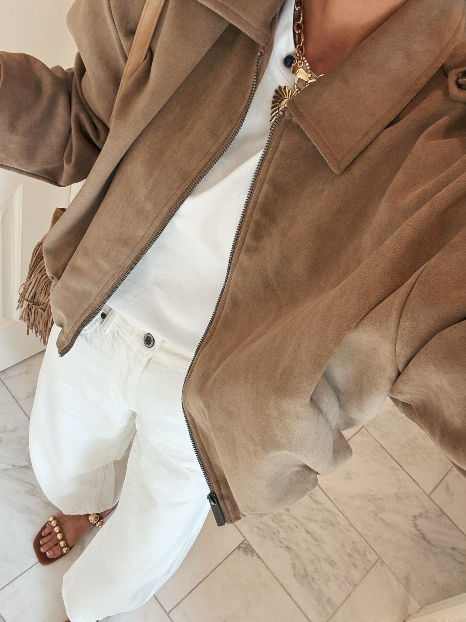 I'm wearing size small in this jacket, small in my $10 t-shirt and 2 in my Zara jeans. All fit tts