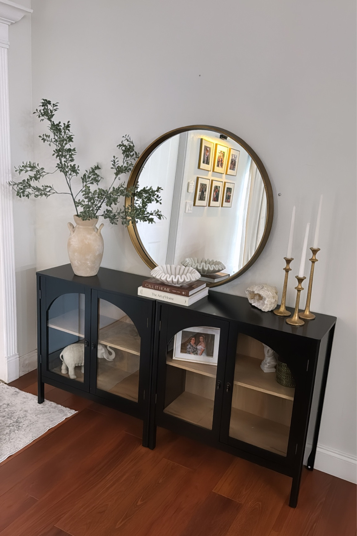 Entryway cabinets and decor that’s elegant but affordable . Black cabinets . 

#LTKstyletip #LTKhome #LTKfindsunder50