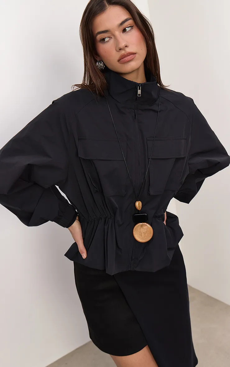 Jackets & Coats | Black Funnel Neck Cinched Utility Windbreaker | PrettyLittleThing | PrettyLittleThing UK
