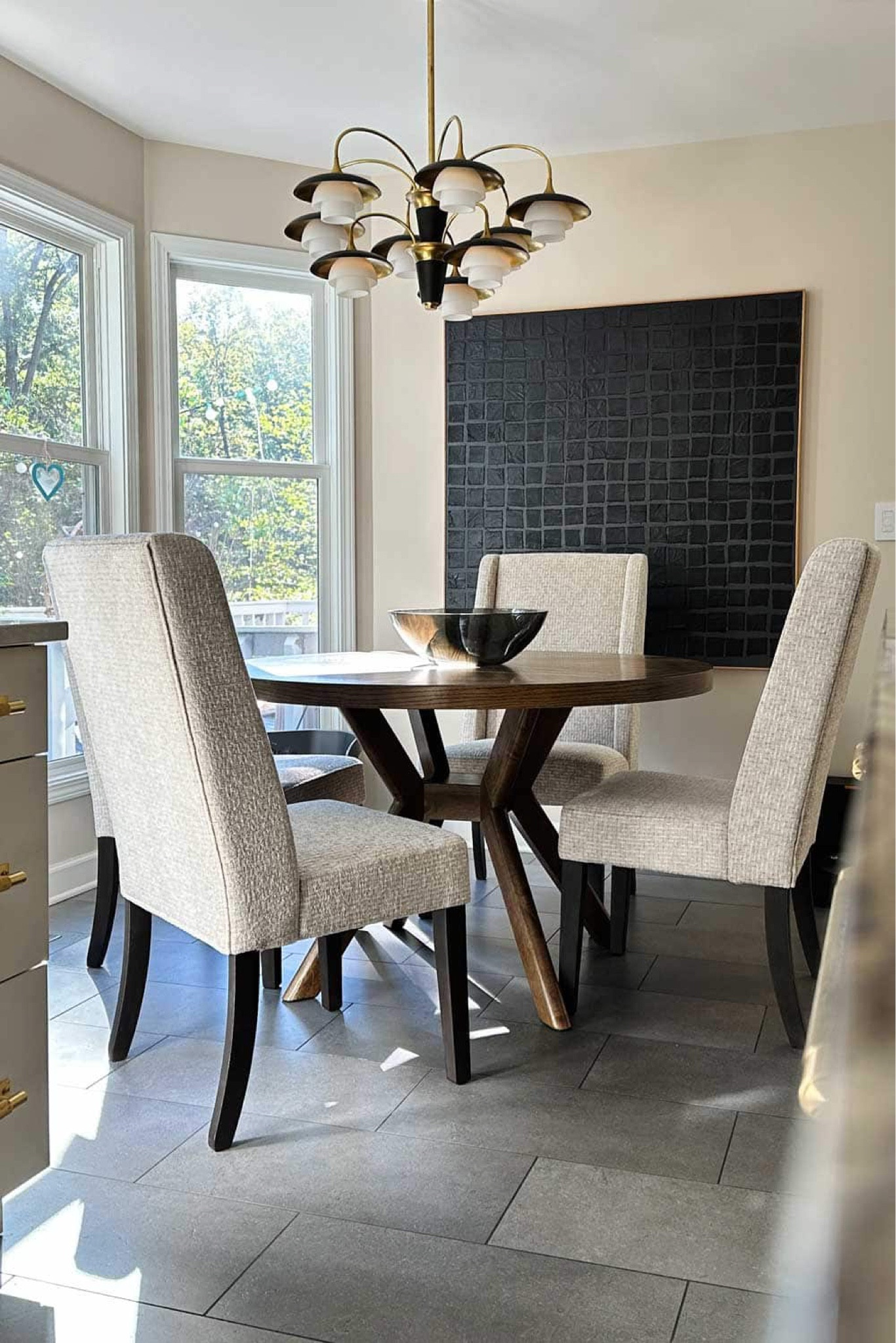 #ad This round wood kitchen table added so much warmth to my all white kitchen. And these padded windows back dining chairs are so comfy and cozy. Found @AshleyOfficial at an affordable price point. Great way to refresh your home for holiday entertaining. 

@AshleyOfficial #AshleyPartner #MyAshleyHome #AshleyFinds

Round table, wood table, round wood table, kitchen table, kitchen chairs, wing back chairs, dining chairs with a tall back, transitional dining chairs, affordable furniture, affordable dining set, affordable chairs, dining chairs on a budget, budget friendly furniture, home decor, home decorating, affordable decor 

#LTKHome #LTKStyleTip