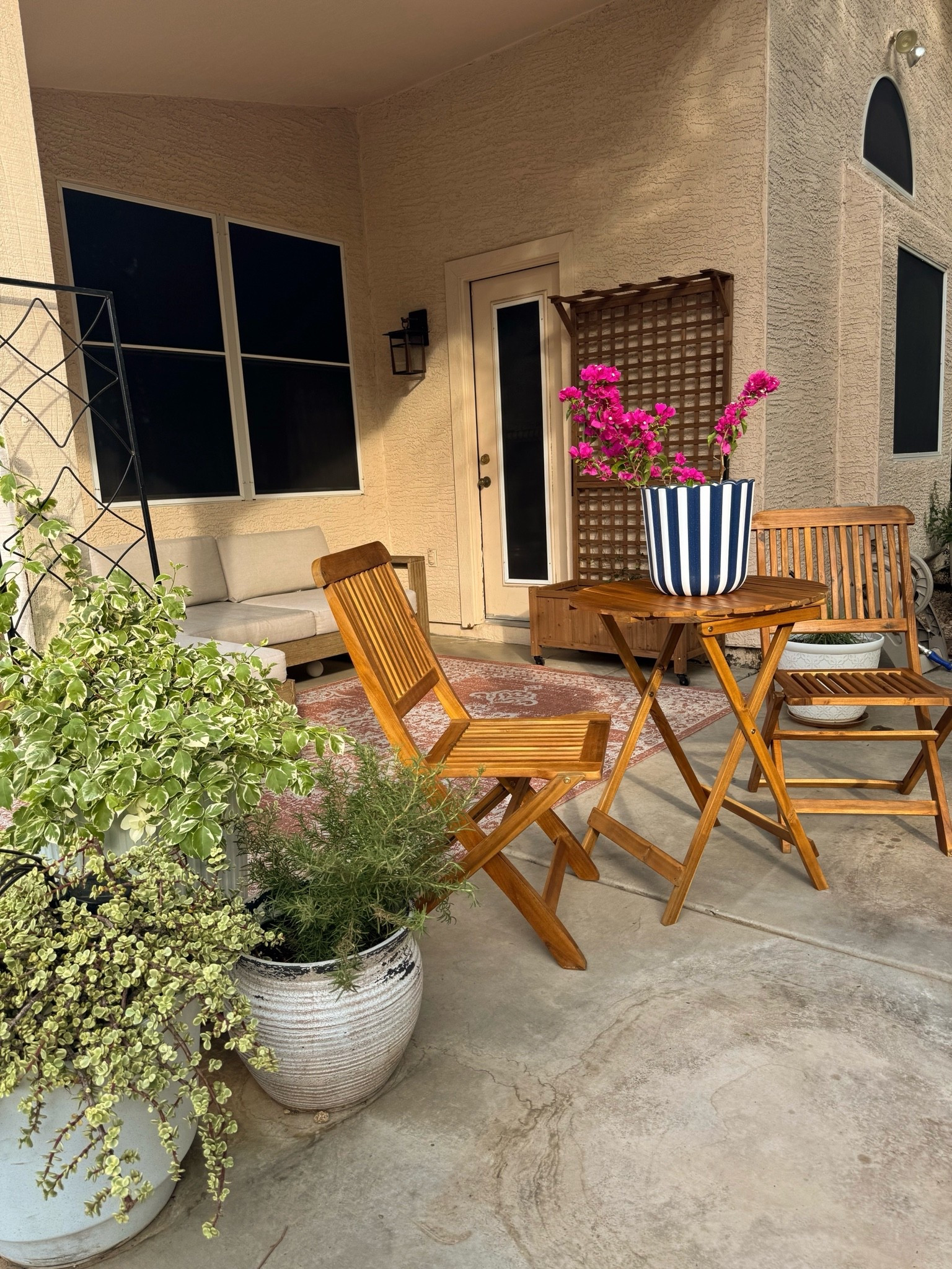 LTK CAPTION

#lowespartner #ad @lowes  
Small Patio Makeover just in time for summer! I found the most beautiful patio decor at @Lowe’s This wooden bistro table set is the perfect place for my morning coffee and it can be folded and stored away during our summer monsoon storms. I love this trellis planter on wheels! The climbing star jasmine is going to make such a statement once it fills in. I even found a beautiful terracotta patio rug that fits my European style patio theme. 

Keywords:
Patio decor. Patio ideas. Small patio ideas. Trellis planter. Patio planters. All white planter pots. Lowe’s patio decor.

#LTKHome #LTKSeasonal #LTKSaleAlert