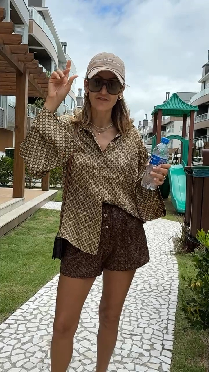 A breezy silk matching set (ideal for throwing on during a beach vacation!) I love the boxer style fit of these shorts and think they pair perfectly with this button up top. I know winter is very much in full swing back in the states, but if you have any trips planned, this outfit is a must-pack. Styled it with a baseball cap, sunglasses, and a bag! 

#LTKStyleTip #LTKOver40 #LTKTravel