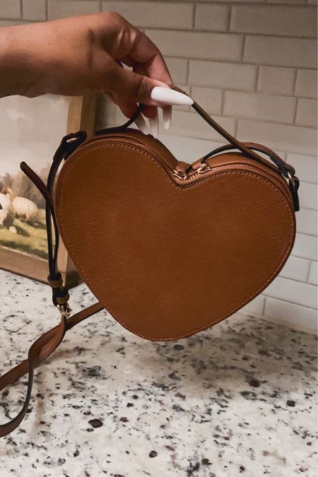 How cute is this heart-shaped purse? It comes in black, tan, and a blush pink. It’s perfect and right from Kohl’s  

#LTKitbag #LTKfindsunder50 #LTKSpringSale