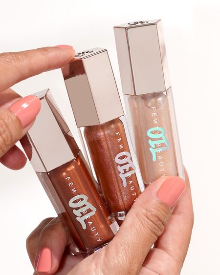 New @fentybeauty Gloss Bomb Lip Oils 💛 They're smooth, cushiony and have the prettiest shine! Swatches of all three shades:

$uperfine $uga sheer white gold shimmer
Fro$ted Bunz amber iridescent sparkle
Coppa Cookie metallic copper

#LTKBeauty