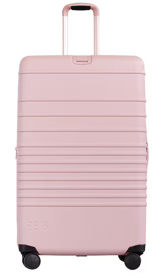 The Large Check-In Luggage in Atlas Pink | Revolve Clothing (Global)