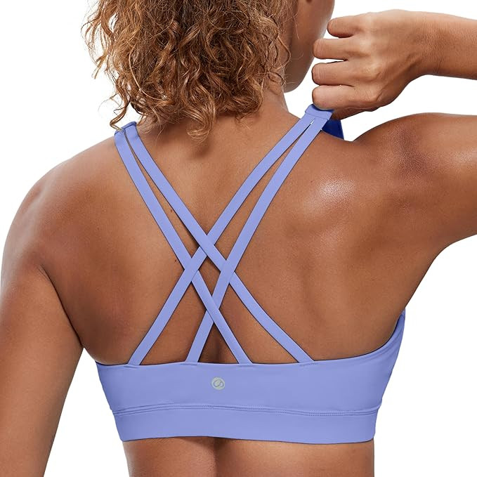 CRZ YOGA Women's Strappy Sports Bras Fitness Workout Padded Yoga Top Criss Cross Back Cami | Amazon (US)