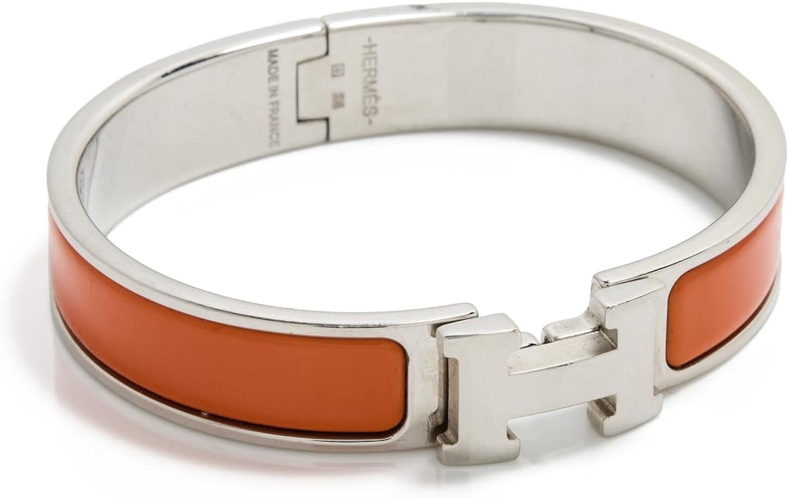 WHAT GOES AROUND COMES AROUND Women's Pre-Loved Hermes Orange Silver Clic Clac Narrow Bangle | Amazon (US)