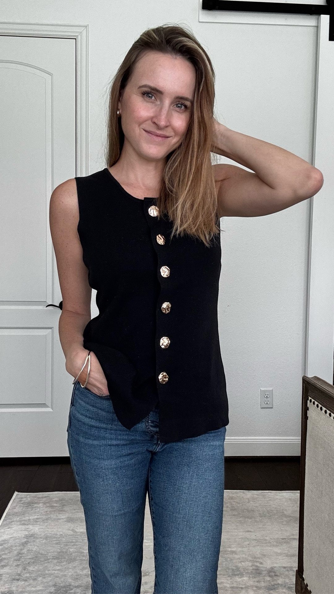 A thin sweater vest with functioning buttons from Amazon. Very comfortable, comes in a few colors and true to size. 