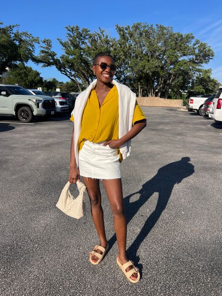 Easy summer outfit! White wrangler staud denim skirt, yellow gauze button up shirt, woven knotted purse, raffia double buckle slide sandals and white crewneck sweatshirt  

#LTKFindsUnder50 #LTKFindsUnder100 #LTKShoeCrush