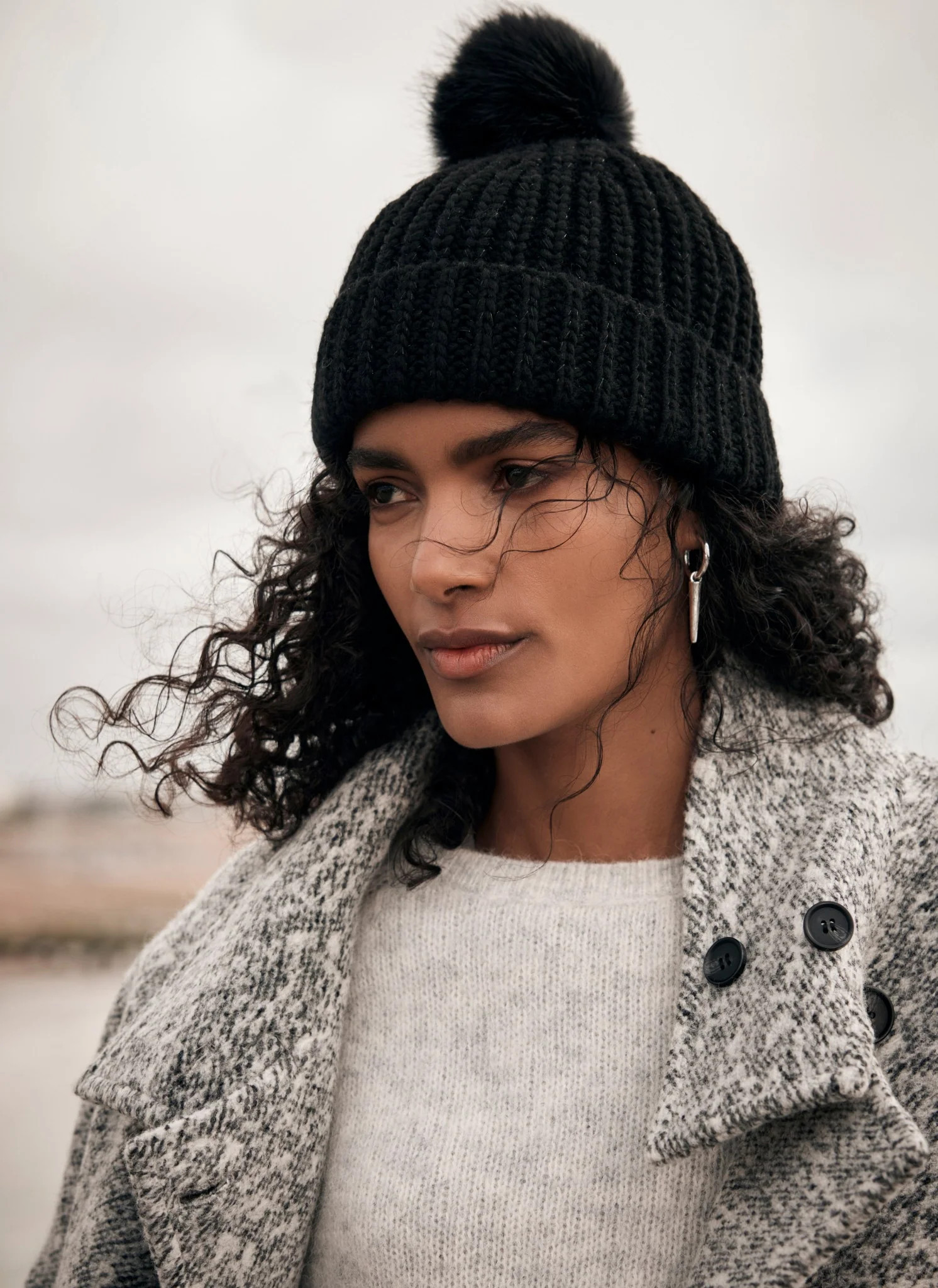 Black Faux Fur Pom Pom Beanie Hat | Mint Velvet