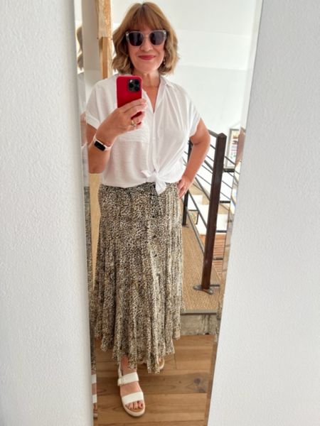 White tie up blouse, maxi pattern skirt, white sandals, red phone case 

#LTKover40 #LTKSeasonal #LTKeurope