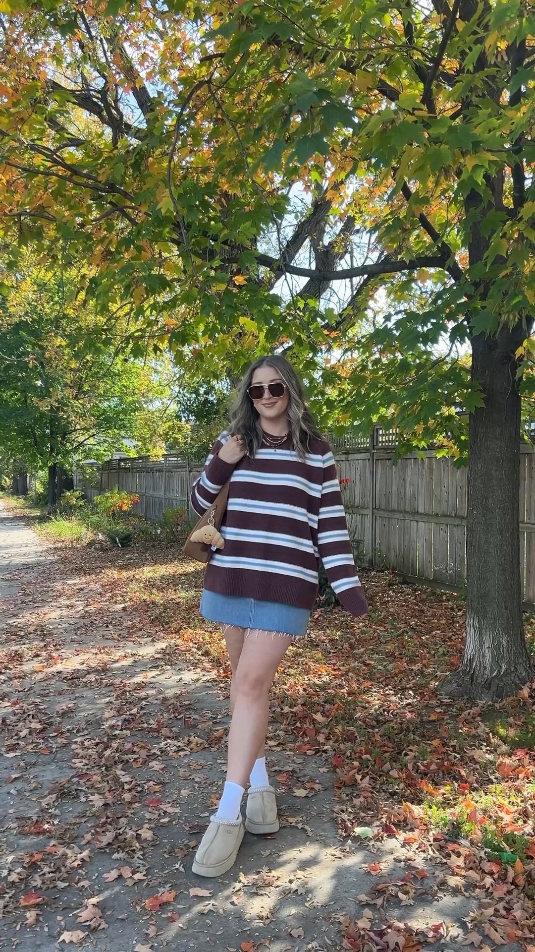 Casual fall outfit from @abercrombie! Sized up to XL in the striped sweater for an oversized fit. I bought this denim skirt last year in a size 32, if I was repurchasing I would get a 30 or 31. I’m a 30 in their jeans! Ugg Tazz platforms are so comfy and TTS