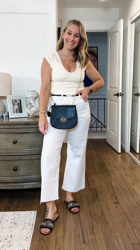 Love this bag! I use it as my fancy going out bag and just a casual crossbody! The logo is my favorite!! It’s leather with gold details. Medium bodysuit and true to size 29 pants in regular/classic length  

#LTKItBag #LTKMidsize #LTKStyleTip