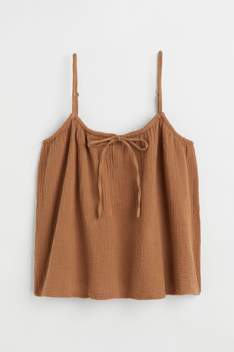 Relaxed-fit camisole top in soft woven fabric. Narrow, adjustable shoulder straps, round neckline... | H&M (US + CA)