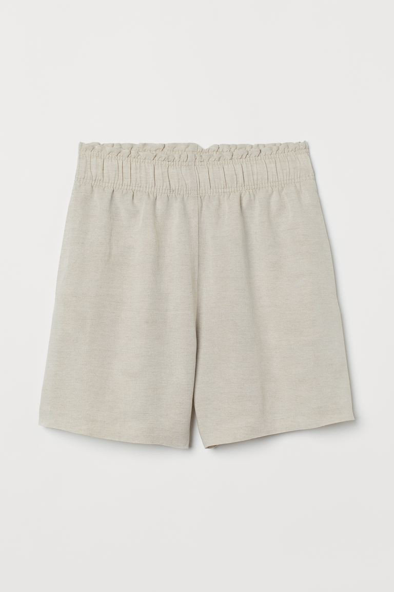 Shorts in a linen and viscose weave. High waist with covered elastication and a small frill trim,... | H&M (UK, MY, IN, SG, PH, TW, HK)