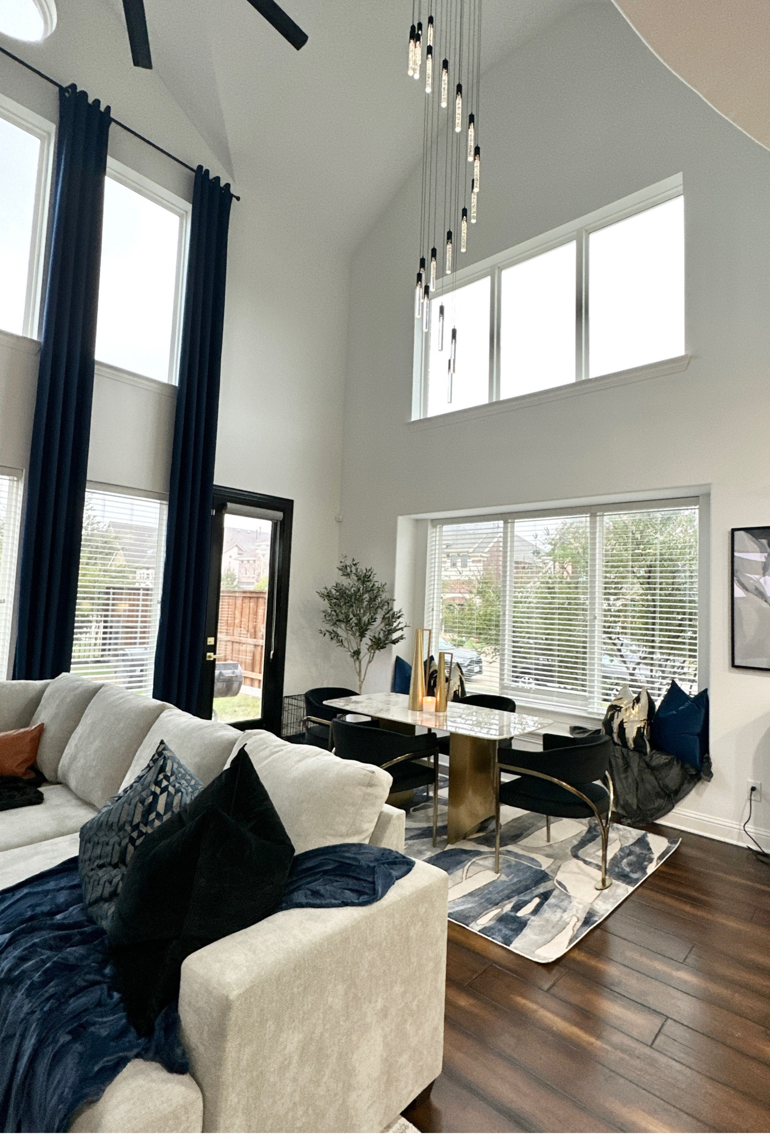 Dining Room Decor: Rug • Table • Chairs • Throw Blanket • Olive Tree • Pillows • Gold Vases • Curtains • Curtain Rod • Chandelier 

#LTKsalealert #LTKfindsunder100 #LTKhome