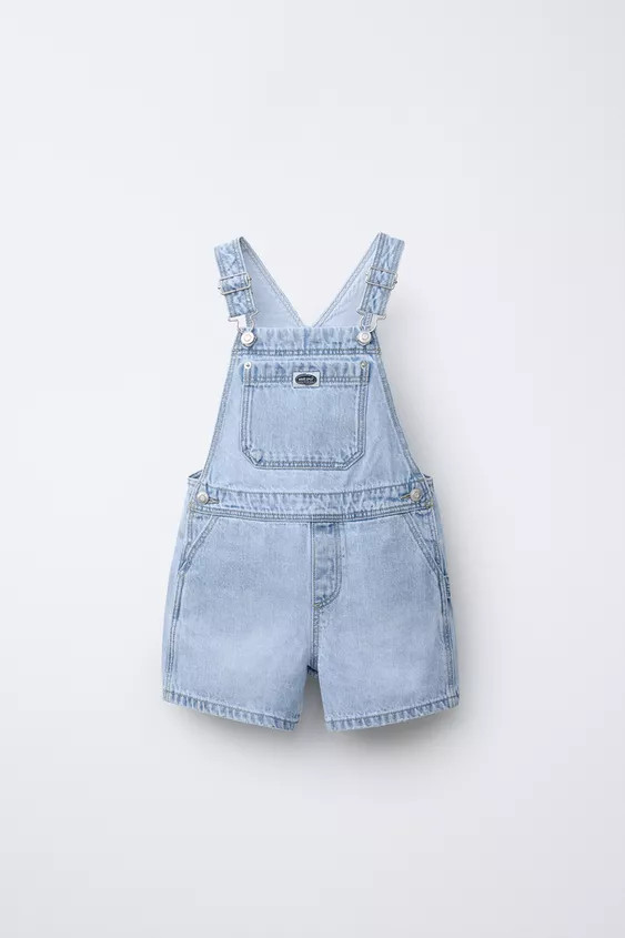 Short dungarees with a straight neckline and front buckle fastening straps. Featuring front pocke... | Zara UK