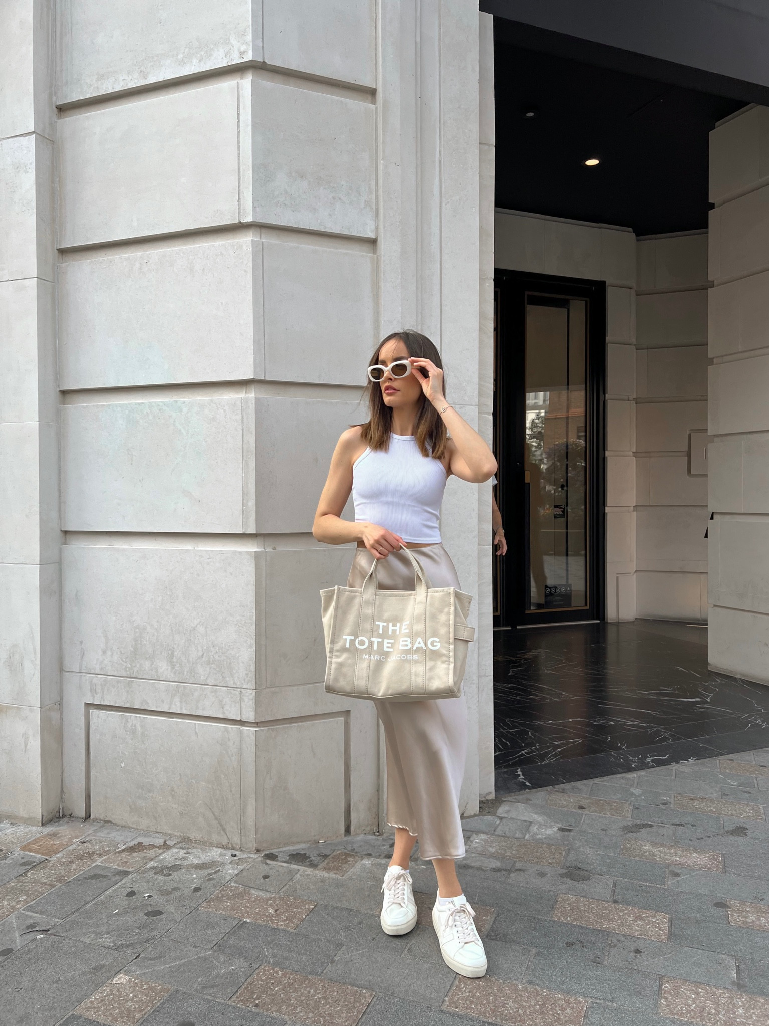 White tank top, silk satin skirt, white trainers, tote bag beige, white sunglasses 

#LTKSeasonal #LTKstyletip #LTKeurope