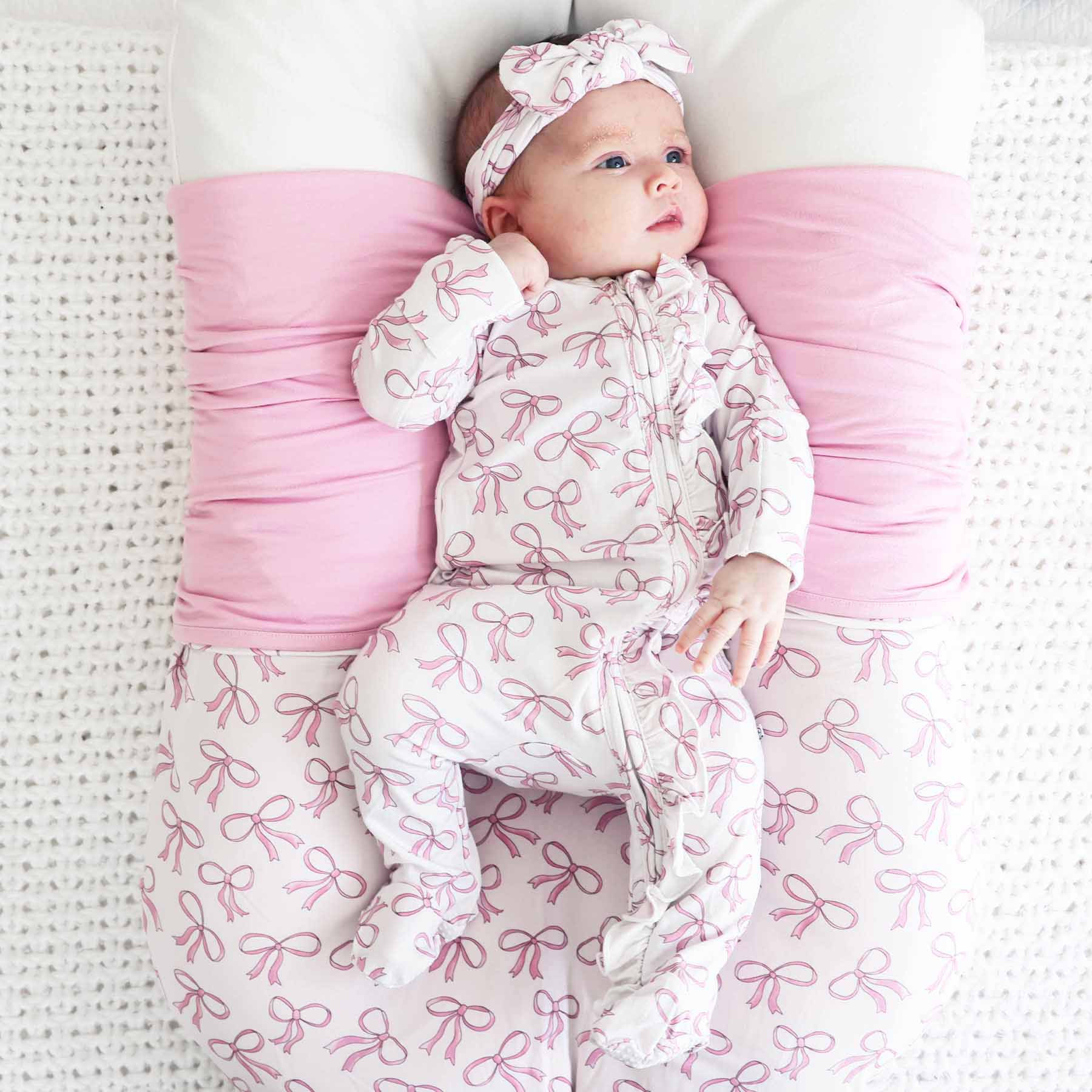 Blushing Bows Ruffle Zipper Footie | Caden Lane