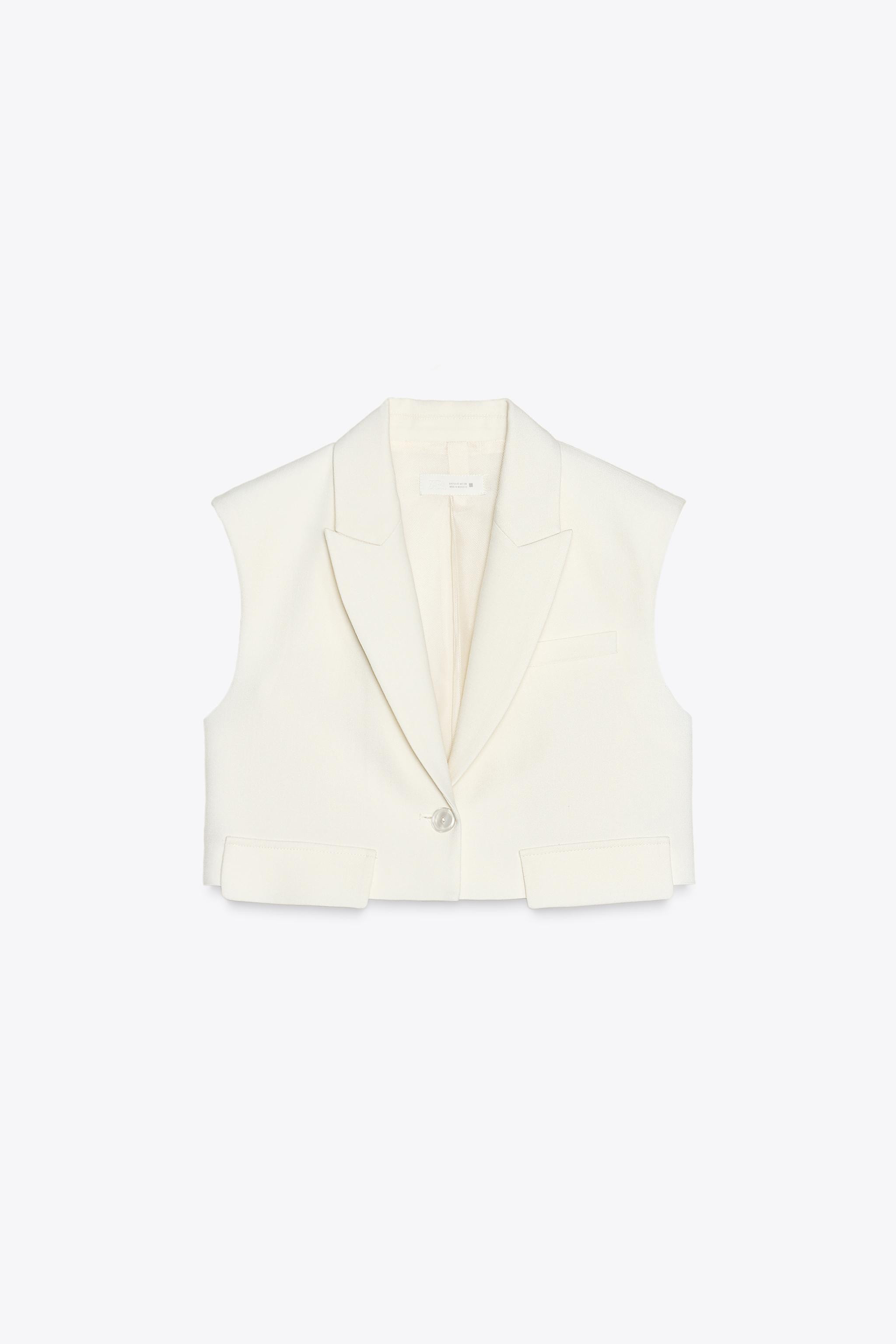 SHORT FLAP VEST$ 59.90Ecru | 2406/603/712Add to cartAddLapel collar vest with armholes and should... | Zara US