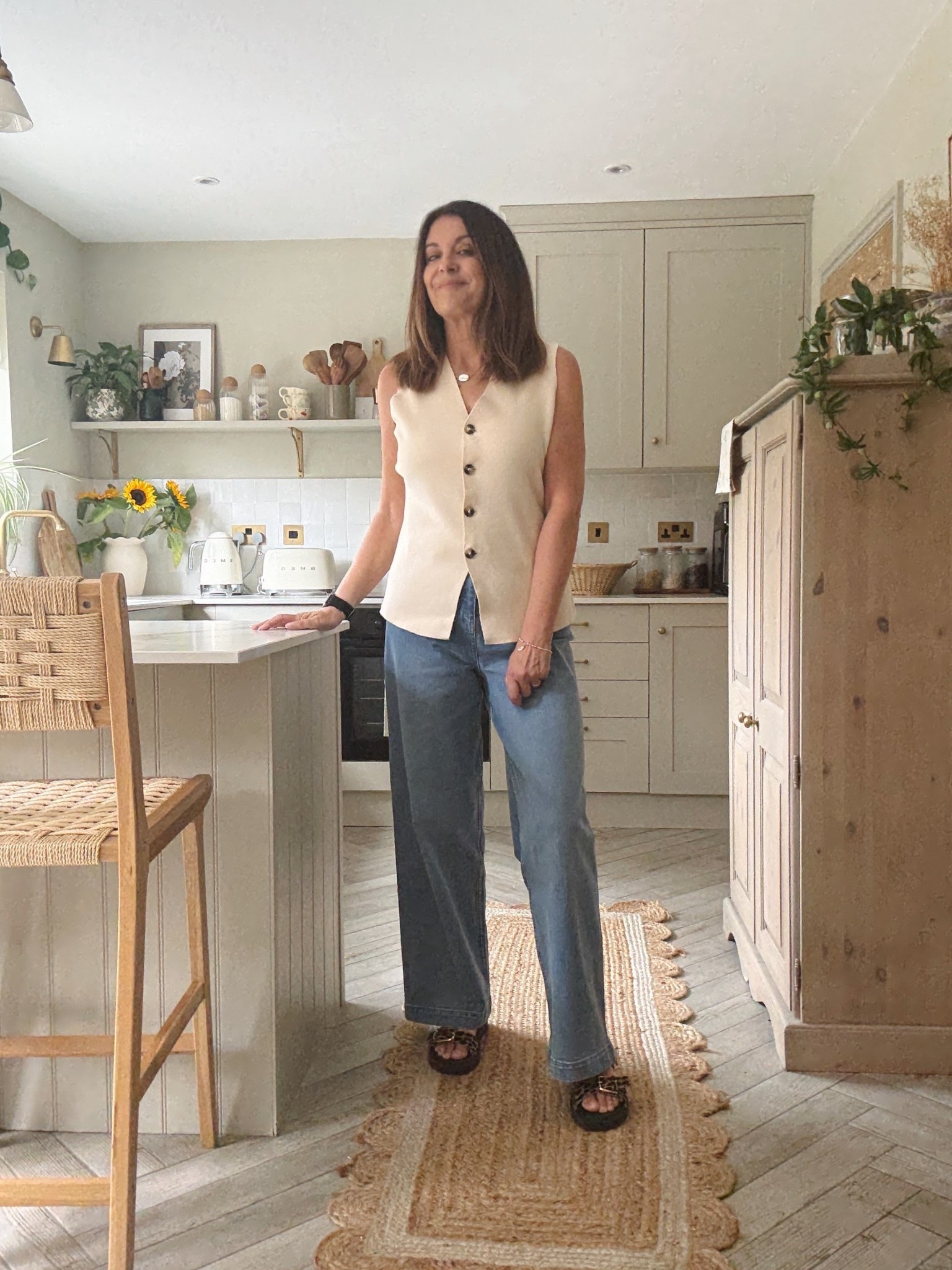 What I’m wearing. Stretchy wide leg jeans and a soft knitted waistcoat top (can also be worn over a T-shirt or shirt). Teamed with leopard print chunky sandals. 

#LTKover50style #LTKuk #LTKsummer