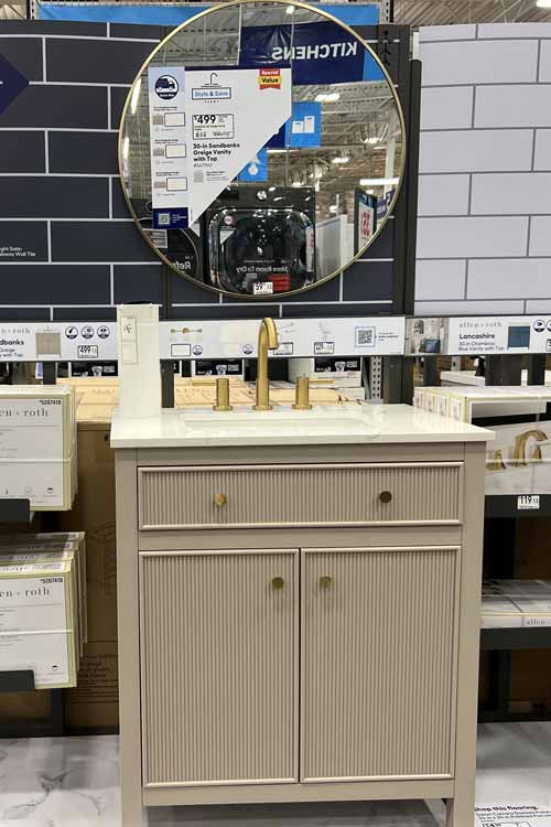 Greige bathroom vanity with white top and gold round mirror  

#LTKStyleTip #LTKOver40 #LTKHome