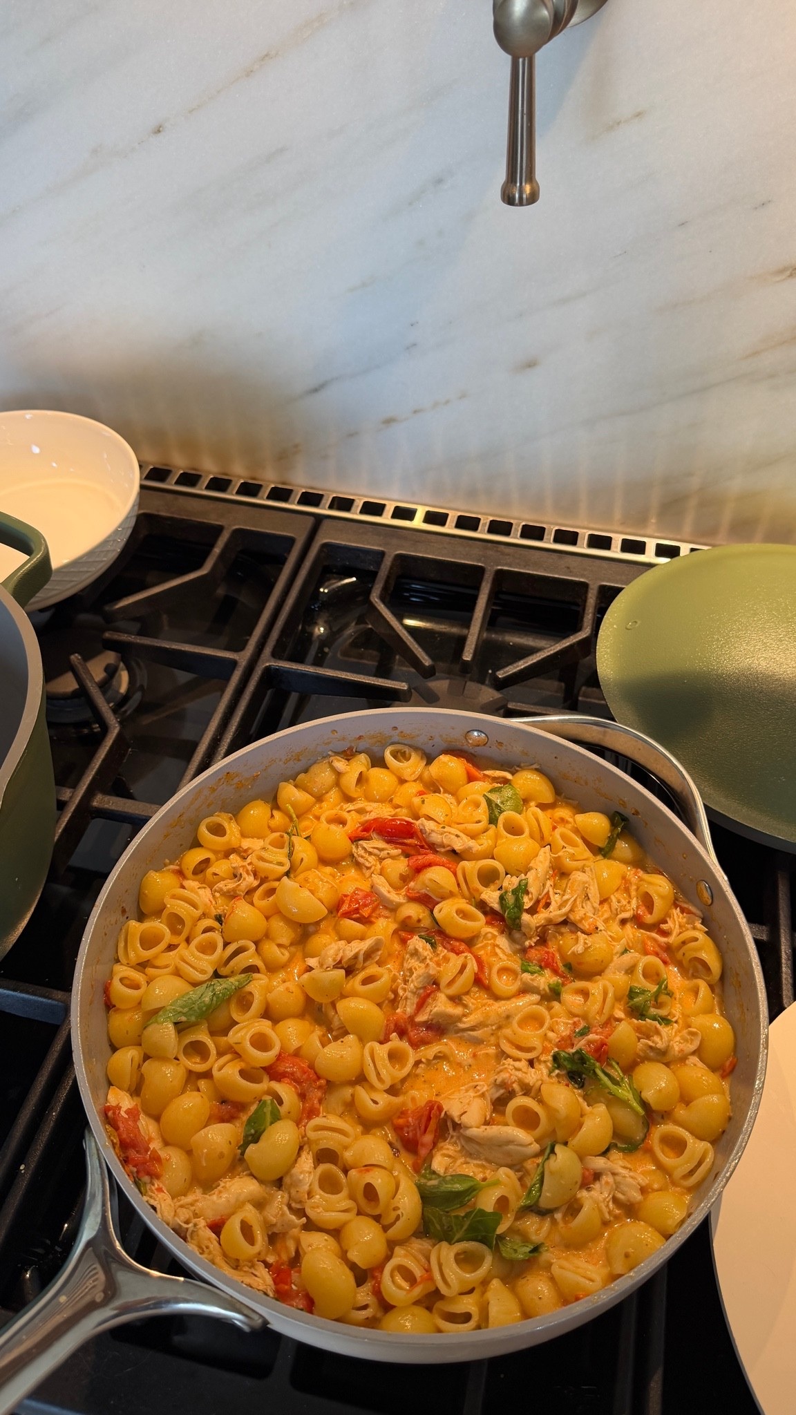Feta chicken pasta recipe: 

	⁃	Sauté 5 cloves of mashed garlic in EVOO and toss in a bunch of cherry tomatoes 
	⁃	Dried oregano, salt, pepper, paprika and red pepper flakes to taste
	⁃	1 cup of bone broth (Ashely adds sugar or white wine) 
	⁃	Let us cook for about 20 min
	⁃	Squish the tomatoes and add two thin blocks of feta cheese
	⁃	Add shredded chicken for some lean protein (cooked separately)  
	⁃	Stir until melted and add cooked pasta with fresh basil leaves