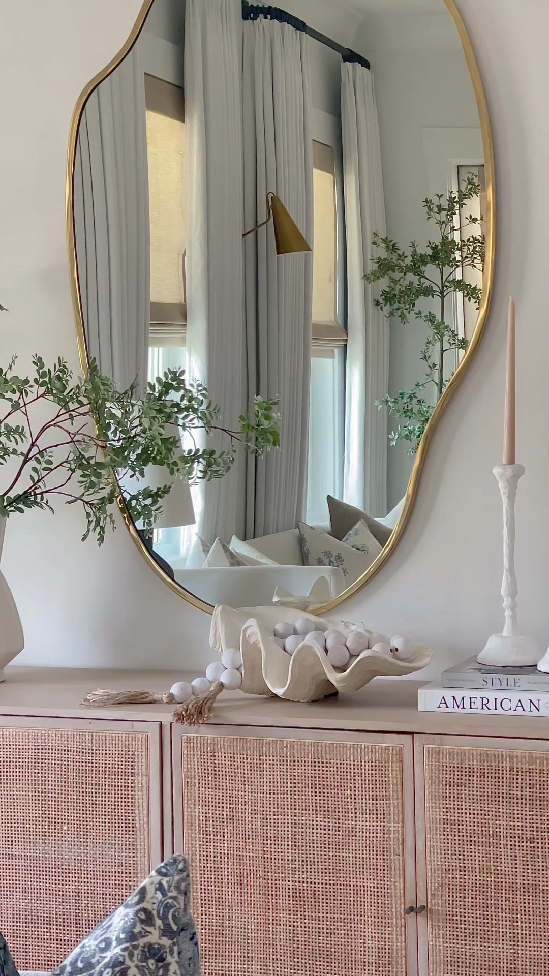 Entryway decor, home decor, living room decor, brass puddle mirror, coastal decor, wooden bead strand, white vase, white candle holders, shell decor, crate and barrel, Lulu and Georgia, pottery barn pillows 

#LTKHome #LTKSeasonal #LTKSaleAlert